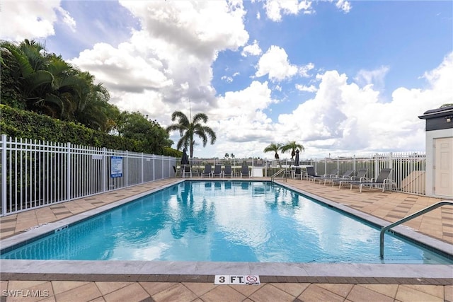 6769 Berwick Pl, Naples, FL 34104 - community pool with a patio area