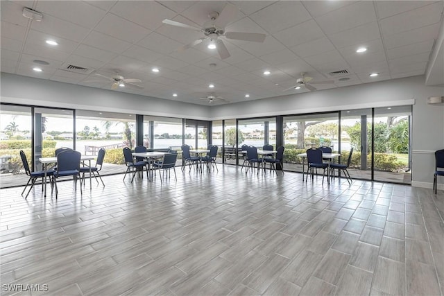 6769 Berwick Pl, Naples, FL 34104 - interior space featuring a ceiling fan, light wood finished floors, a paneled ceiling, and recessed lighting