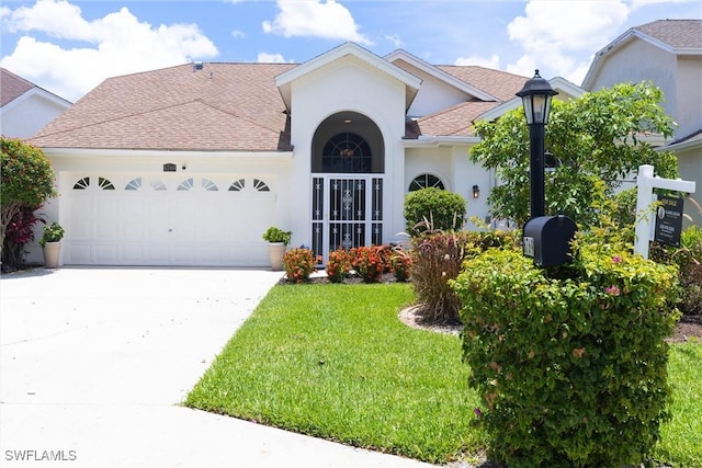 6769 Berwick Pl, Naples, FL 34104 - view of front of house with roof with shingles, stucco siding, an attached garage, driveway, and a front lawn
