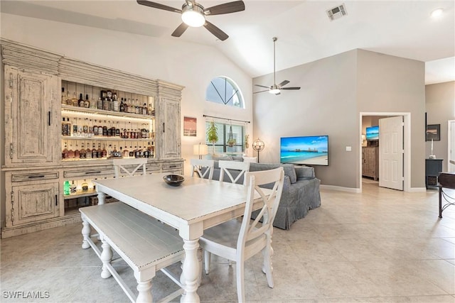 6769 Berwick Pl, Naples, FL 34104 - dining room featuring a ceiling fan, high vaulted ceiling, and light tile patterned floors