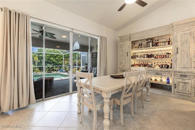 6769 Berwick Pl, Naples, FL 34104 - dining room featuring ceiling fan, vaulted ceiling, and light tile patterned floors