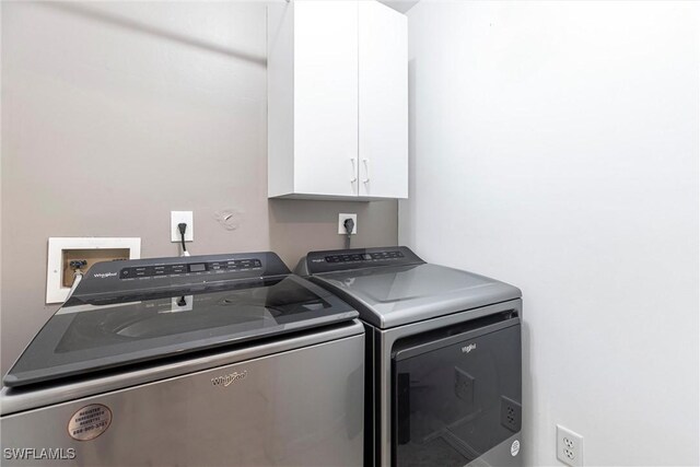 6769 Berwick Pl, Naples, FL 34104 - washroom featuring cabinet space and washer and dryer