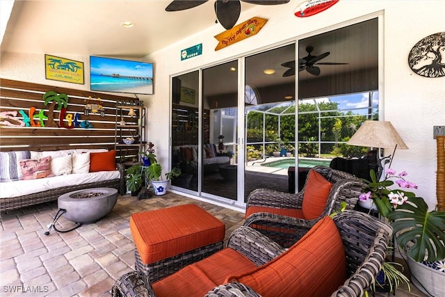 6769 Berwick Pl, Naples, FL 34104 - view of patio / terrace featuring a ceiling fan, a hot tub, and outdoor lounge area