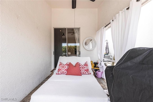 6769 Berwick Pl, Naples, FL 34104 - bedroom featuring a textured wall and ceiling fan