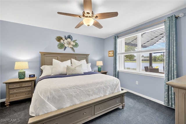 14803 Edgewater Cir, Naples, FL 34114 - bedroom featuring dark colored carpet and ceiling fan