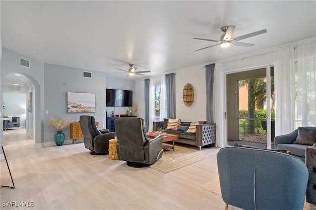 3948 Pomodoro Cir Unit 102, Cape Coral, FL 33909 - living room featuring ceiling fan, arched walkways, and light wood-style floors