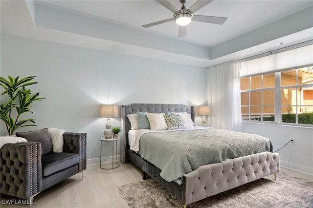 3948 Pomodoro Cir Unit 102, Cape Coral, FL 33909 - bedroom featuring a raised ceiling and a ceiling fan