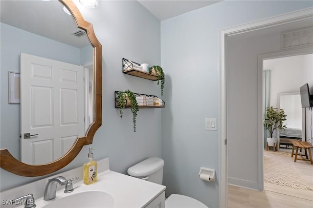 3948 Pomodoro Cir Unit 102, Cape Coral, FL 33909 - bathroom with vanity and wood finished floors