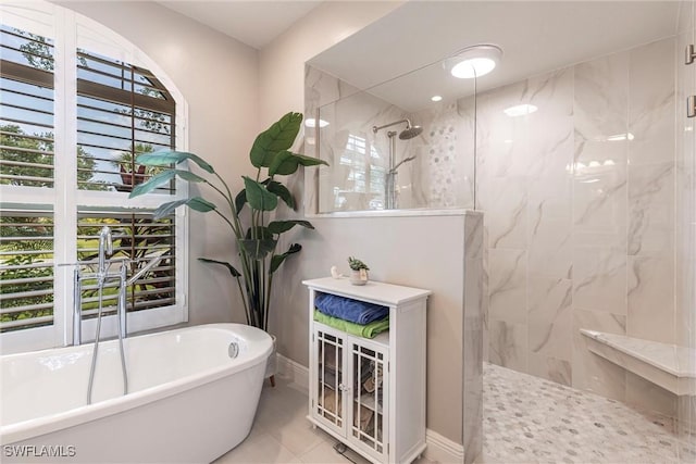 4372 Bittern Ct, Naples, FL 34119 - full bathroom with a marble finish shower and a freestanding bath