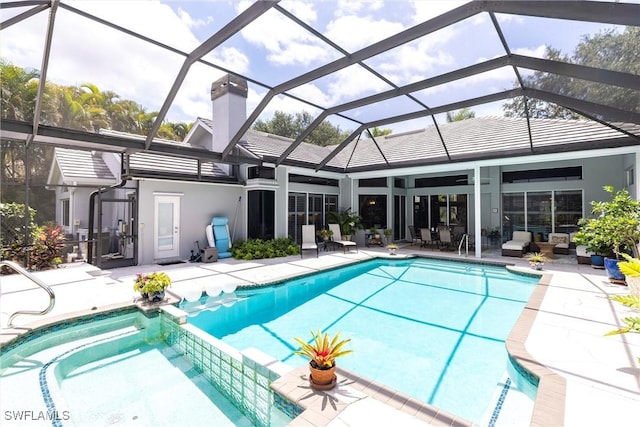 4372 Bittern Ct, Naples, FL 34119 - view of swimming pool featuring a patio area, a pool with connected hot tub, and a lanai