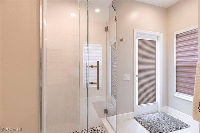 4372 Bittern Ct, Naples, FL 34119 - bathroom featuring a stall shower, tile patterned floors, and recessed lighting