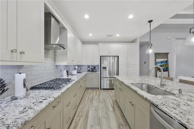 10082 Palazzo Dr, Naples, FL 34119 - kitchen with stainless steel appliances, wall chimney exhaust hood, tasteful backsplash, pendant lighting, and recessed lighting