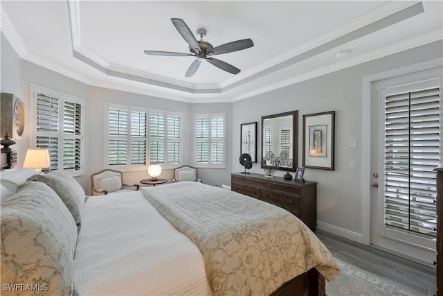 10082 Palazzo Dr, Naples, FL 34119 - bedroom with a raised ceiling, crown molding, wood finished floors, and ceiling fan