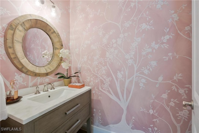10082 Palazzo Dr, Naples, FL 34119 - bathroom featuring wallpapered walls and vanity