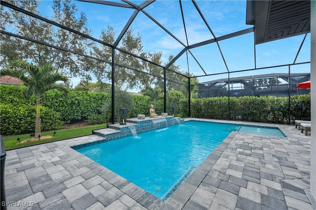 10082 Palazzo Dr, Naples, FL 34119 - outdoor pool featuring a patio area and glass enclosure