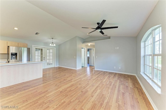 5482 Globe Ter, North Port, FL 34286 - unfurnished living room featuring french doors, light wood-style floors, vaulted ceiling, and ceiling fan