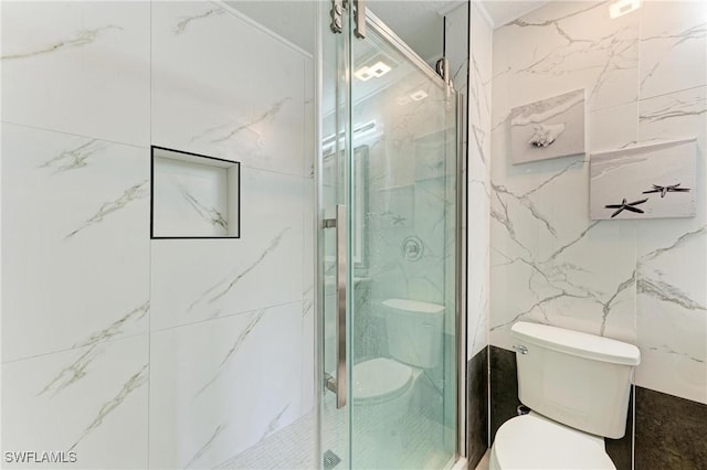 5482 Globe Ter, North Port, FL 34286 - bathroom featuring a marble finish shower and tile walls