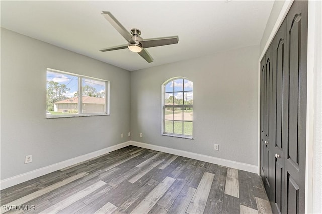 5482 Globe Ter, North Port, FL 34286 - empty room featuring healthy amount of natural light, dark wood-type flooring, and ceiling fan