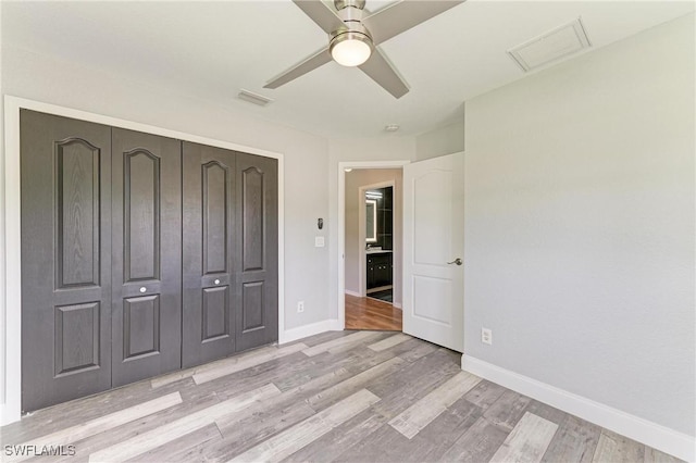 5482 Globe Ter, North Port, FL 34286 - unfurnished bedroom with light wood-style floors, a closet, and ceiling fan