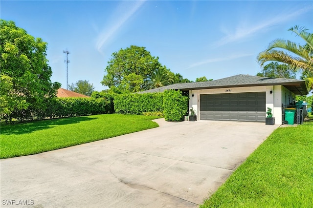 2491 43rd St SW, Naples, FL 34116 - view of front of property featuring stucco siding, concrete driveway, a front yard, and an attached garage