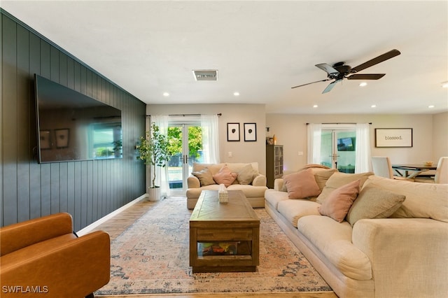 2491 43rd St SW, Naples, FL 34116 - living area featuring wood finished floors, a ceiling fan, recessed lighting, and wood walls