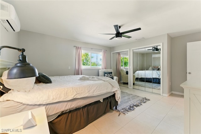 2491 43rd St SW, Naples, FL 34116 - bedroom with a wall mounted air conditioner, two closets, light tile patterned floors, and ceiling fan
