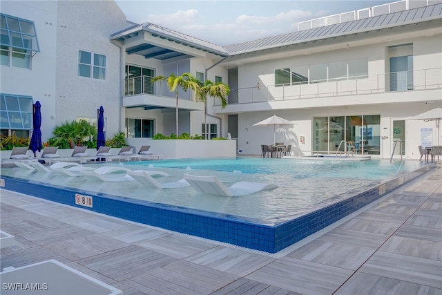201 8th St S Unit 208, Naples, FL 34102 - community pool featuring a patio area