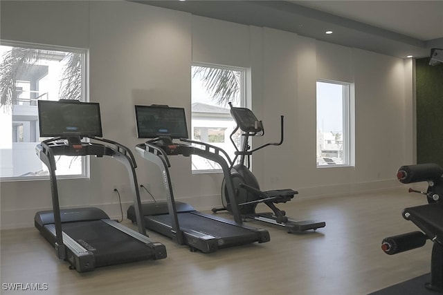 201 8th St S Unit 208, Naples, FL 34102 - exercise room with wood finished floors, healthy amount of natural light, and recessed lighting