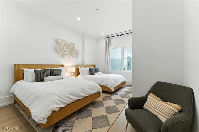 201 8th St S Unit 208, Naples, FL 34102 - bedroom with light wood finished floors and recessed lighting