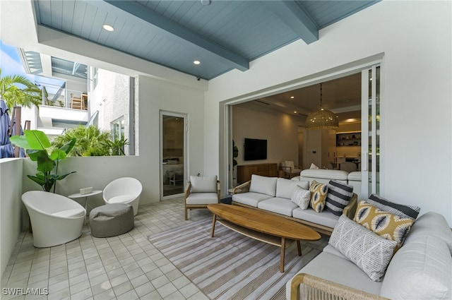 201 8th St S Unit 208, Naples, FL 34102 - tiled living area with a wooden ceiling with exposed beams