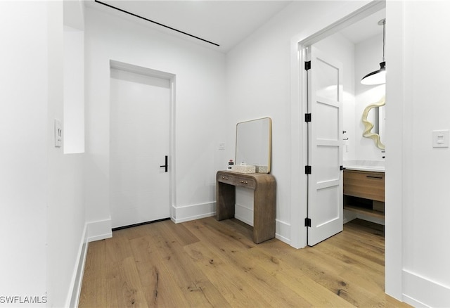 201 8th St S Unit 208, Naples, FL 34102 - hall with light wood-style flooring and baseboards