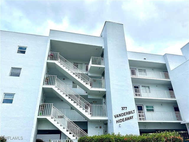 377 Vanderbilt Beach Rd Unit 103, Naples, FL 34108 - view of apartment building / complex with stairway