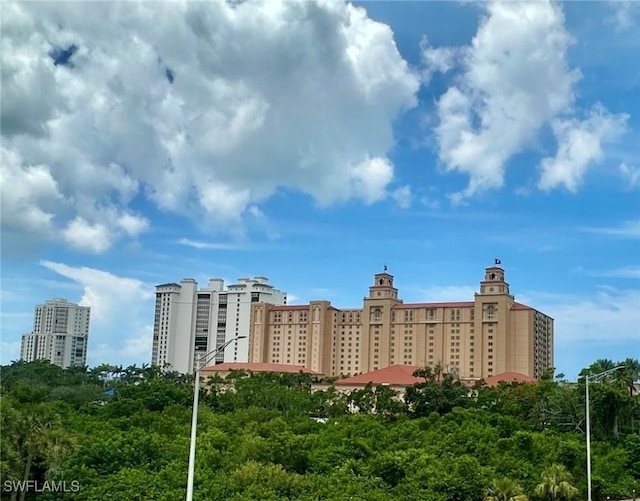 377 Vanderbilt Beach Rd Unit 103, Naples, FL 34108 - view of building exterior with a view of city