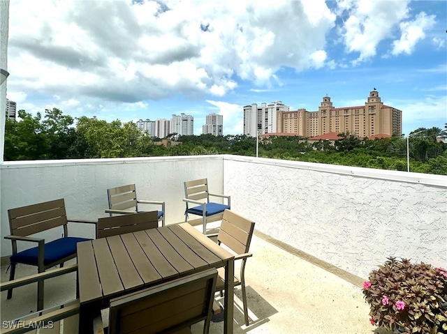 377 Vanderbilt Beach Rd Unit 103, Naples, FL 34108 - view of patio with a view of city and outdoor dining area