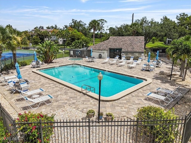 6296 Sugar Bush Ln Unit C, Fort Myers, FL 33908 - community pool with a patio area, a hot tub, and view of scattered trees