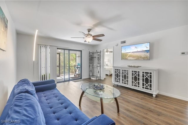 6296 Sugar Bush Ln Unit C, Fort Myers, FL 33908 - living area with ceiling fan and wood finished floors