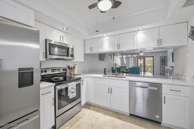 6296 Sugar Bush Ln Unit C, Fort Myers, FL 33908 - kitchen featuring appliances with stainless steel finishes, a ceiling fan, ornamental molding, white cabinets, and light countertops