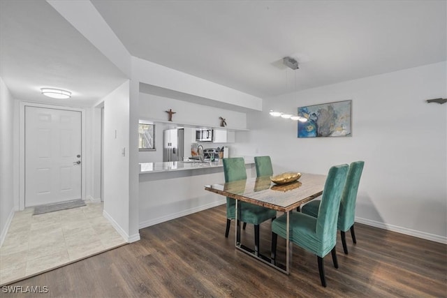 6296 Sugar Bush Ln Unit C, Fort Myers, FL 33908 - dining space with baseboards and wood finished floors