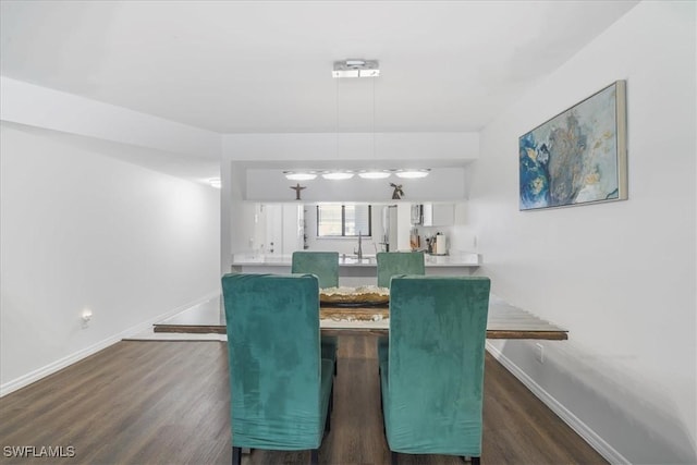 6296 Sugar Bush Ln Unit C, Fort Myers, FL 33908 - dining room featuring wood finished floors and baseboards