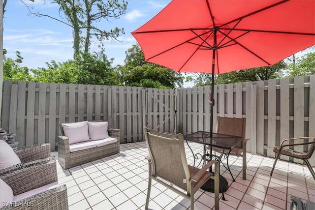 6296 Sugar Bush Ln Unit C, Fort Myers, FL 33908 - fenced backyard featuring an outdoor hangout area, a patio area, and outdoor dining area