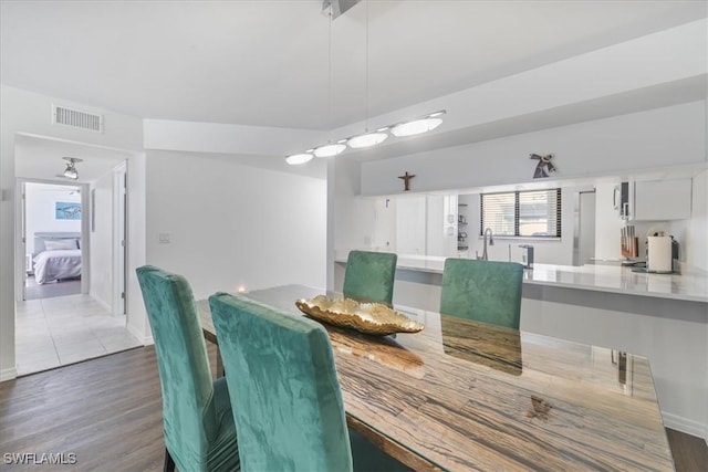 6296 Sugar Bush Ln Unit C, Fort Myers, FL 33908 - dining space with wood finished floors and baseboards