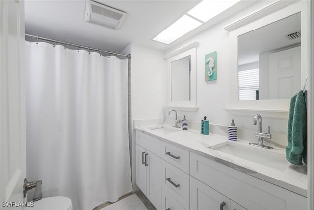 6296 Sugar Bush Ln Unit C, Fort Myers, FL 33908 - bathroom with double vanity and a shower with curtain
