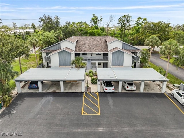 6296 Sugar Bush Ln Unit C, Fort Myers, FL 33908 - view of subject property featuring a tree filled landscape