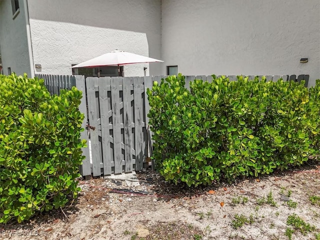 6296 Sugar Bush Ln Unit C, Fort Myers, FL 33908 - exterior view of a gate and stucco siding