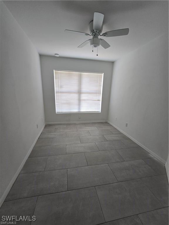 4520 19th St SW, Lehigh Acres, FL 33973 - unfurnished room featuring ceiling fan and tile patterned flooring