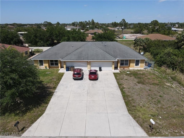 4520 19th St SW, Lehigh Acres, FL 33973 - ranch-style home featuring a garage, concrete driveway, and a front lawn