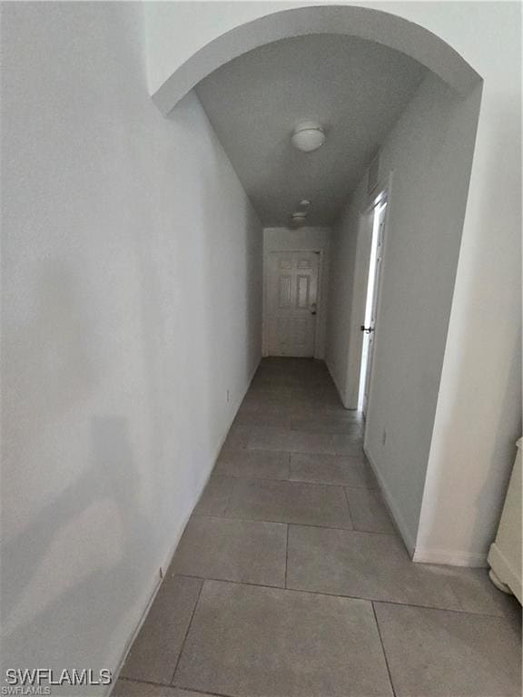 4520 19th St SW, Lehigh Acres, FL 33973 - hall with arched walkways and tile patterned floors