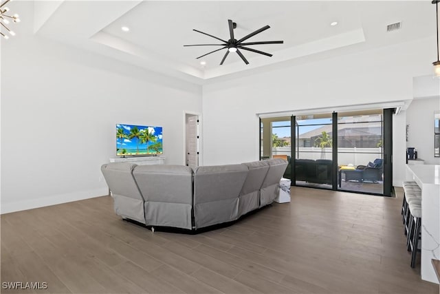 301 NW 36th Ave, Cape Coral, FL 33993 - living area featuring a raised ceiling, ceiling fan, wood finished floors, recessed lighting, and a towering ceiling