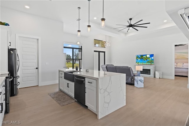301 NW 36th Ave, Cape Coral, FL 33993 - kitchen with dishwasher, light wood-style flooring, open floor plan, ceiling fan, and a center island with sink