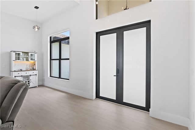 301 NW 36th Ave, Cape Coral, FL 33993 - foyer entrance featuring light wood finished floors and baseboards